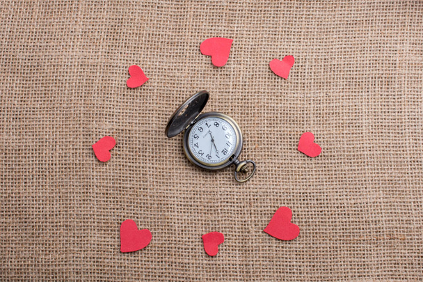  Love concept with pocket watch and  heart shaped icons  - Photo, Image