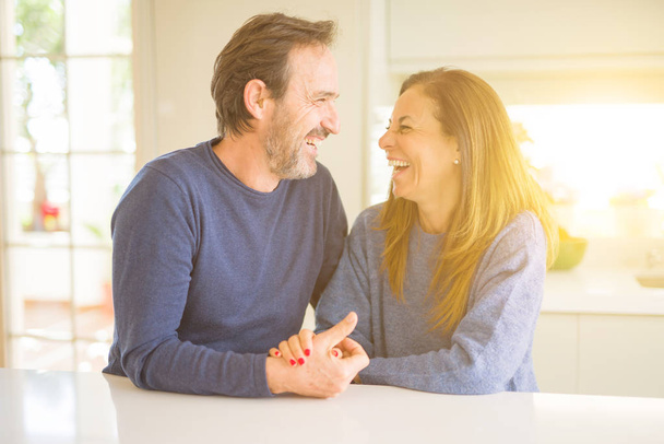 Romantic middle age couple sitting together at home - Photo, image