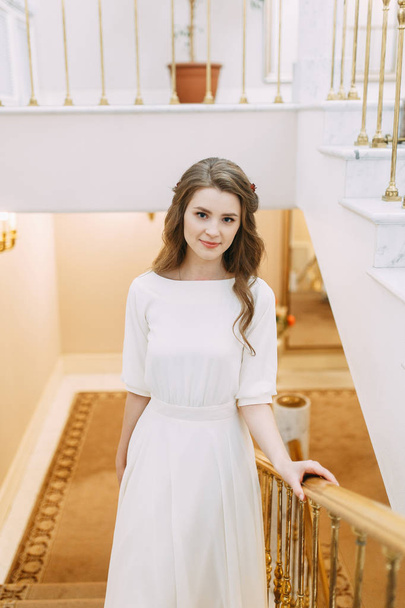 Light wedding photo shoot in European style. The bride before the ceremony at the registry office.  - Fotó, kép