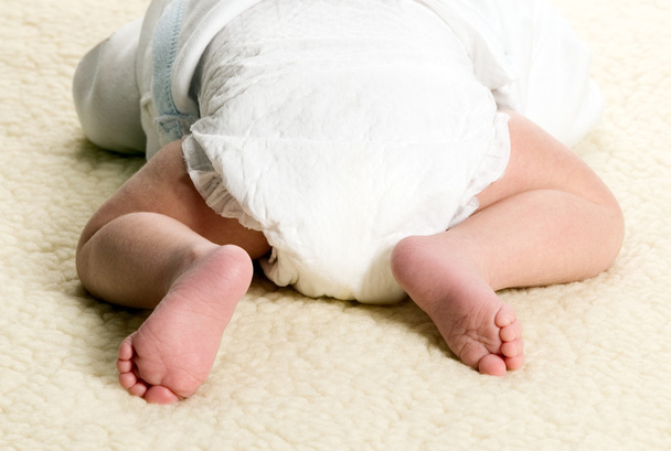Baby boy is lying with diapers - Foto, immagini