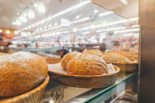 Closeup of bread in the bakery shop. Fresh bread. Organic bread background. Bali island. - Photo, image
