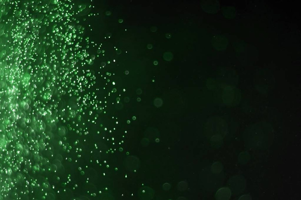 green huge amount flying festive sparkles bokeh texture - cute abstract photo background - Photo, Image