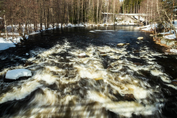 Long exposure photo. Rough river Jokelanjoki and stones in water, Kouvola, Finland. - Photo, Image