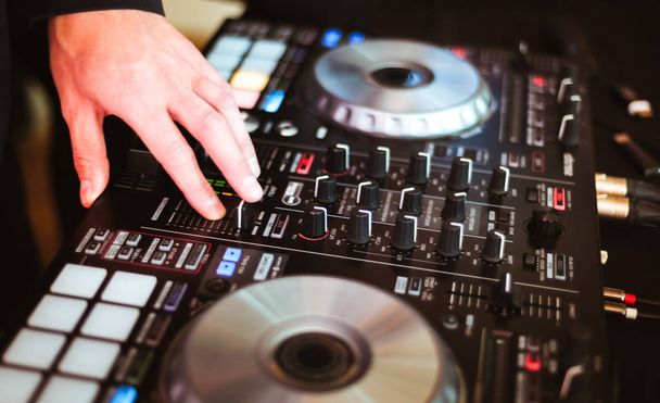 DJ plays and mix music on digital midi controller - Fotografie, Obrázek