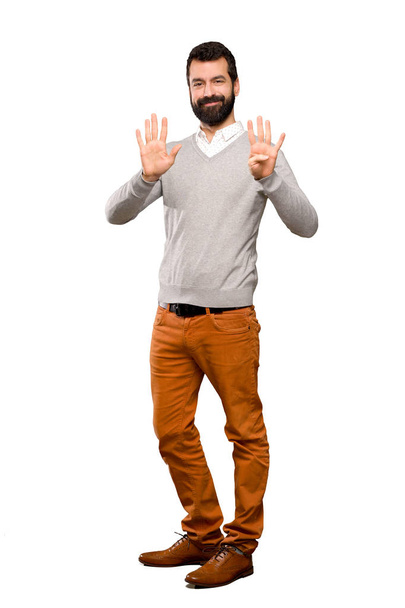Komea mies laskee yhdeksän sormet yli eristetty valkoinen tausta
 - Valokuva, kuva