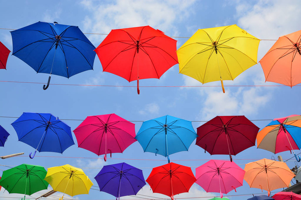 Colorful umbrellas background. Coloruful umbrellas urban street decoration. - Photo, Image