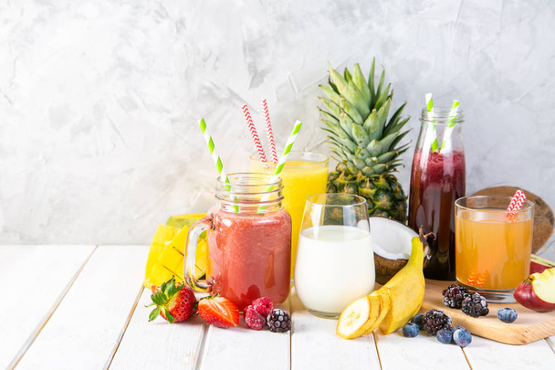 Selection of colourful smoothies in glasses with ingredients - Fotoğraf, Görsel