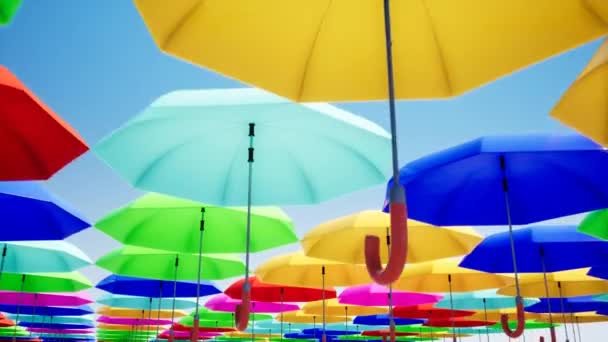 värikkäitä sateenvarjoja roikkuu taivaalla
 - Materiaali, video