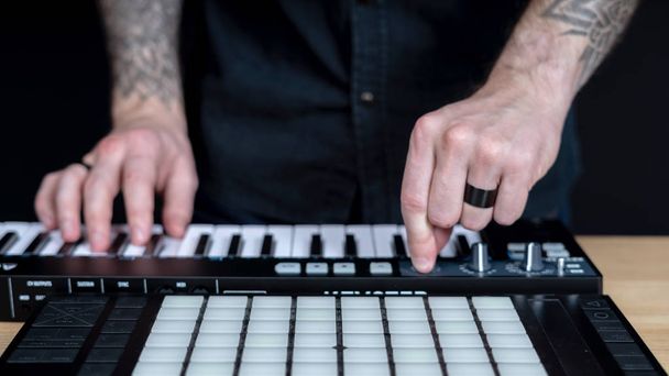 DJ Adult man creates electronic music in the studio - 写真・画像