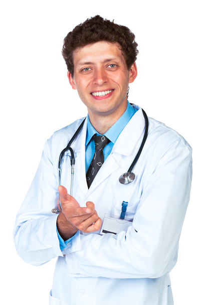 Portrait of a smiling male doctor showing finger at you - Foto, afbeelding