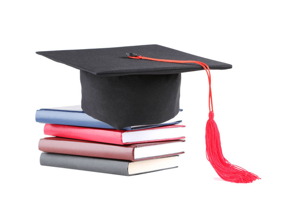 Graduation cap with books isolated on white background - Φωτογραφία, εικόνα