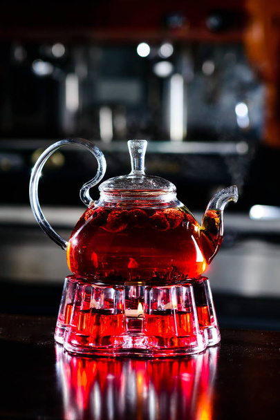 teapot and cup of tea at a cafe - Фото, изображение