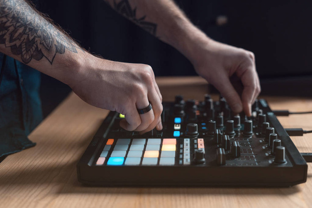 Dj man creates electronic music in the studio - Фото, изображение