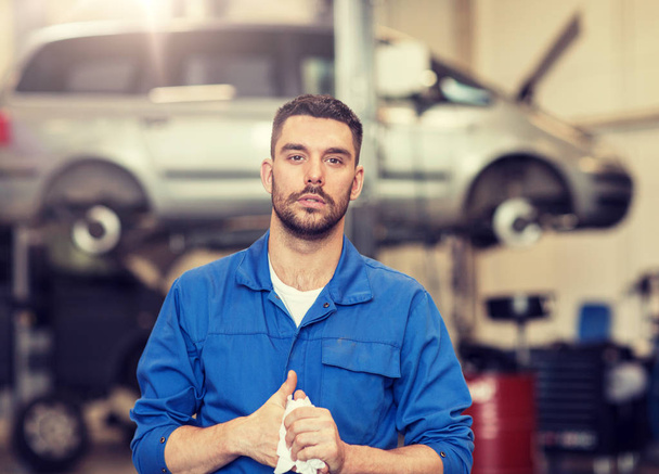 auto mechanic man or smith at car workshop - Fotó, kép