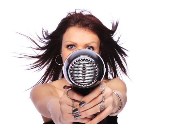 woman with fashion hairstyle holding hairdryer - Фото, зображення