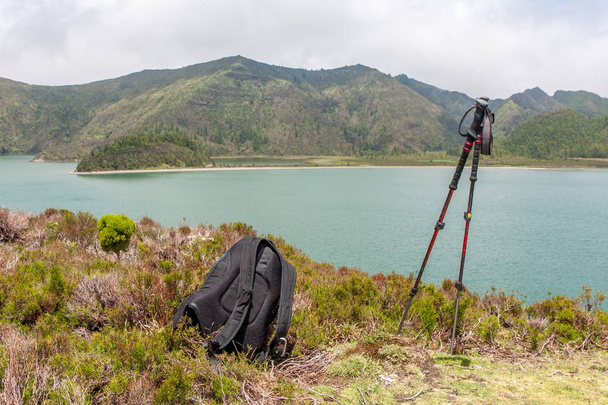 Lake view with backpack and trekking poles - Photo, Image