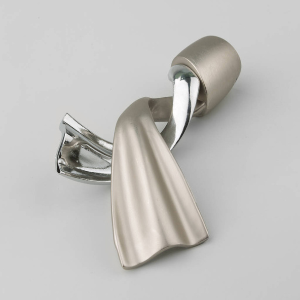 Twisted modern metal ending for curtain pole on grey background - Zdjęcie, obraz