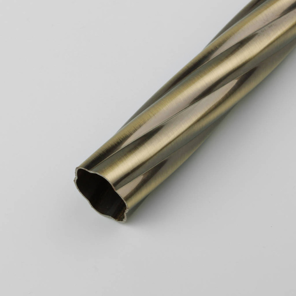Modern metal curtain tube with grooved surface on gray background. - Fotoğraf, Görsel