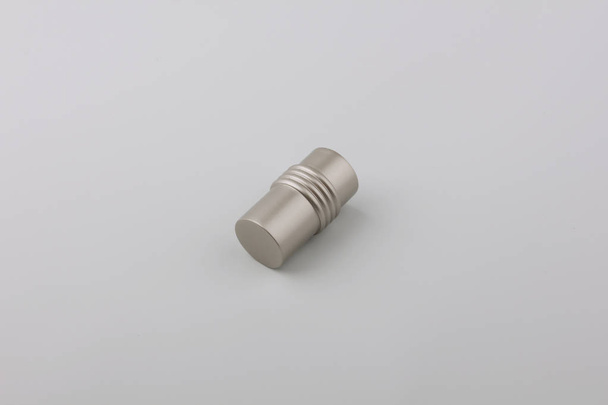 Tube metal plug for curtain eaves on grey background - 写真・画像