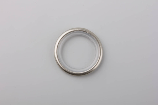 Curtain metal ring for cornice pole on grey background - Φωτογραφία, εικόνα