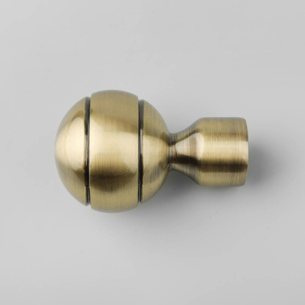 Ball-shaped modern metal ending for curtain eaves on grey background - Fotografie, Obrázek