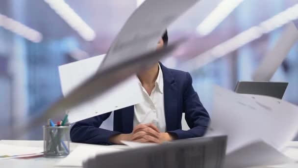 Papers falling around calm female office employee, high tolerance for stress - Felvétel, videó