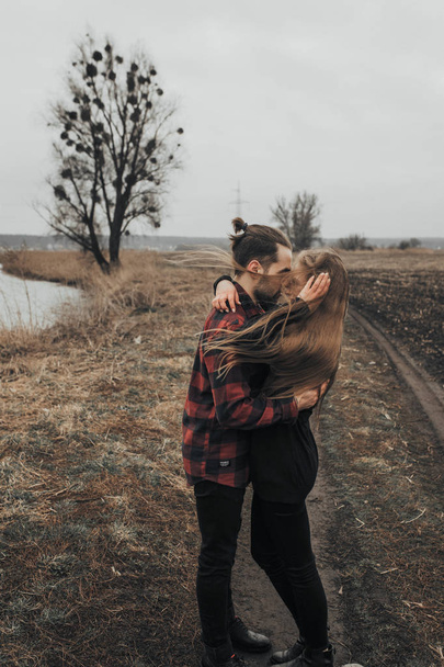 Young romantic couple is kissing and enjoying the company of each other. - Valokuva, kuva