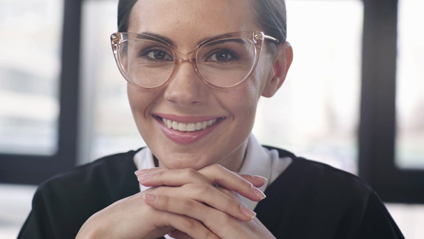 beautiful woman in glasses looking at camera and smiling with  - Footage, Video