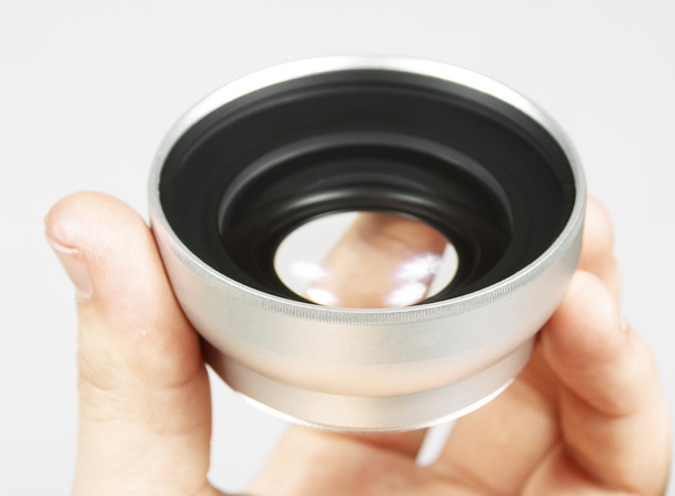 Lens in a hand - Photo, Image