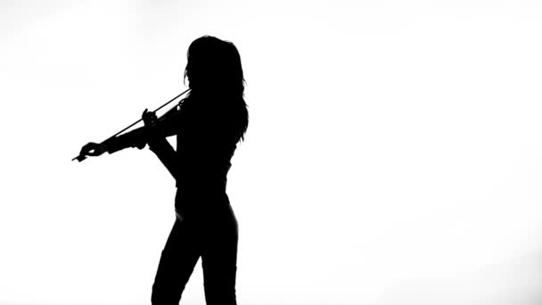 black silhouette on white background young girl in tight black leather clothes expressively plays the electric violin - Filmmaterial, Video