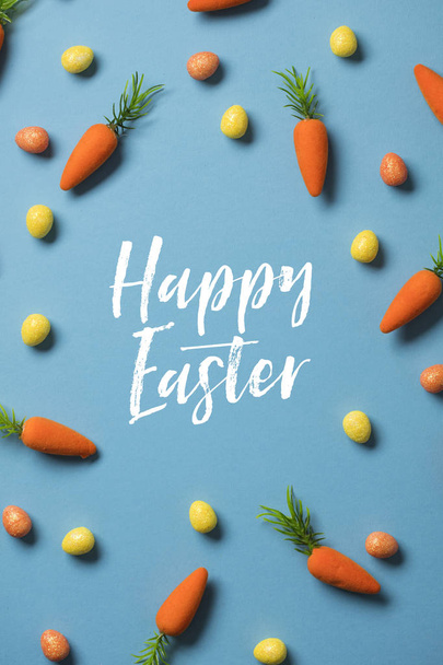 Easter festive background with easter bunny carrots and easter eggs - Фото, зображення