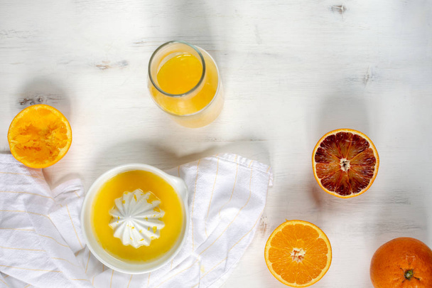 Fresh juicy oranges, fresh squeezed orange juice, refreshing sum - Photo, Image