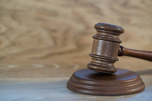 Huge judge's wooden gavel on blurred background - Photo, Image
