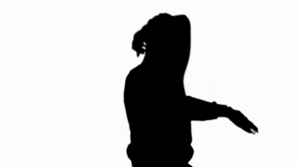Front view of silhouette of man dancing and waving hands isolated on white - Footage, Video