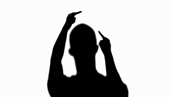 Front view of silhouette of man raising hands and showing middle fingers with aggression isolated on white - Кадри, відео
