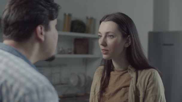 Divorcing couple scolding in domestic kitchen - Filmati, video