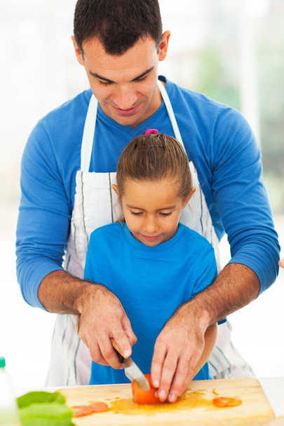 father teaching daughter cooking - Фото, зображення