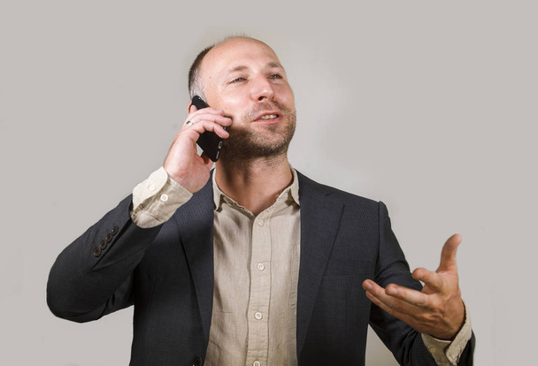 confident successful businessman talking on mobile phone having business conversation with cellphone smiling cheerful in corporate job and entrepreneur success concept - Foto, immagini