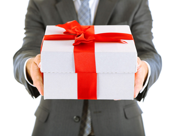 Young businessman present gift box, isolated on white - Fotó, kép