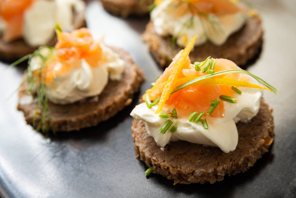 Tray of canaps with smoked salmon and cheese cream  - Photo, Image