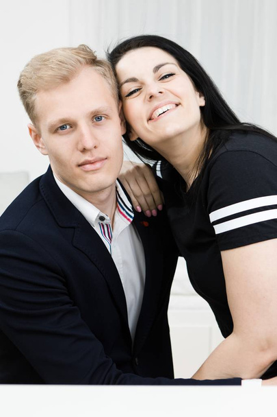 Young attractive business couple in love posing together. - Foto, imagen