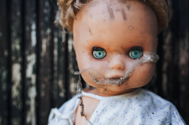Closeup portrait of dirty abandoned doll  - Фото, изображение