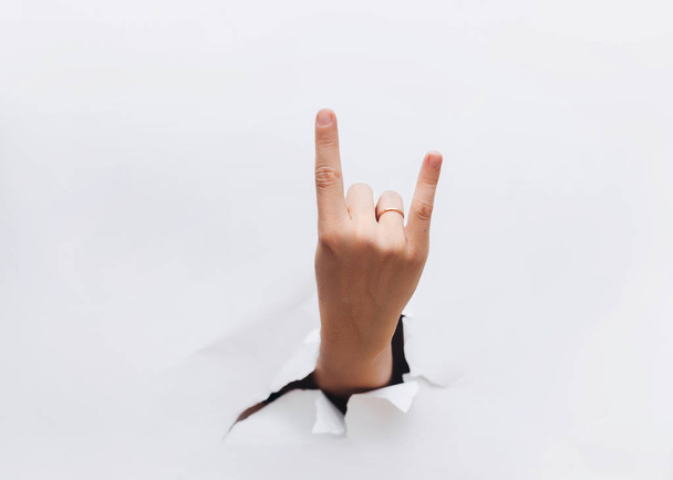 Hand making rock sign on white background. Copy space. Poster. sign language. - Foto, Imagem