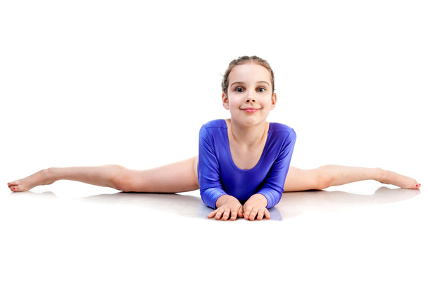 little girl sits on a splits - Foto, immagini