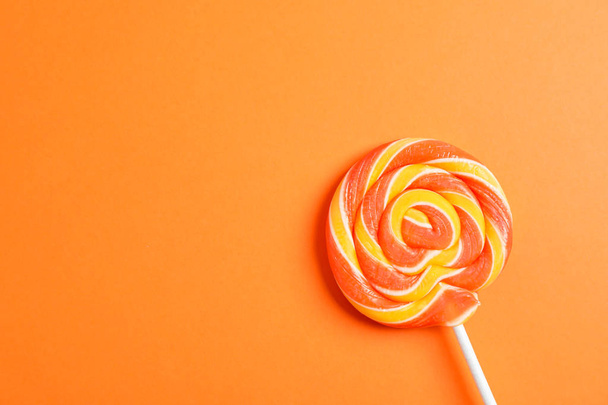 Sweet candy with space for text on color background, closeup - Photo, image