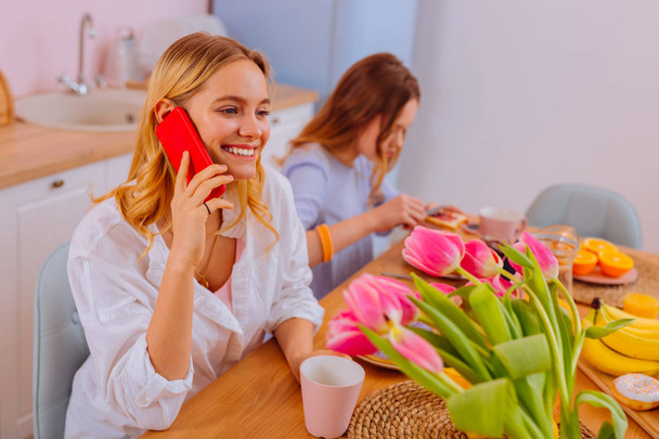 Beautiful young woman calling her boyfriend in the morning - Photo, image