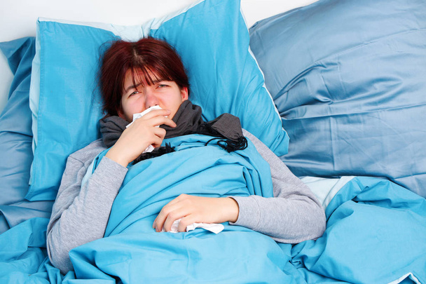 Image of sick woman lying on bed . - Zdjęcie, obraz