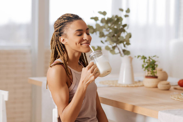 Woman after finishing workout drinking protein shake - Photo, Image