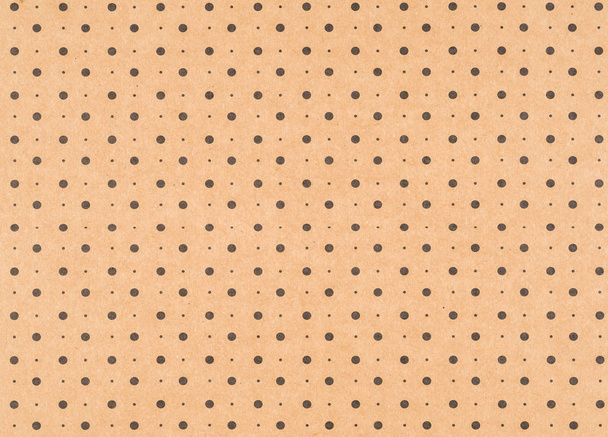Papel artesanal marrón con un patrón de punto negro
 - Foto, imagen