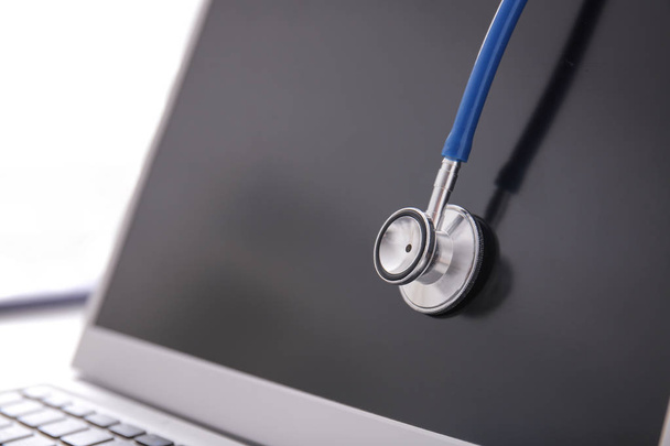 Laptop with stethoscope, closeup - Photo, Image